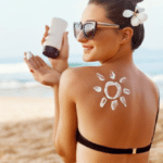 Woman Applying Sun Cream on Shoulder