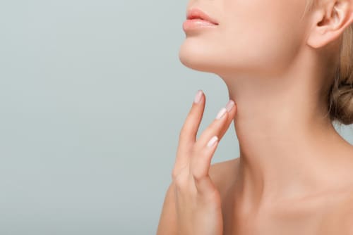 Cropped,View,Of,Woman,Touching,Neck,Isolated,On,Grey