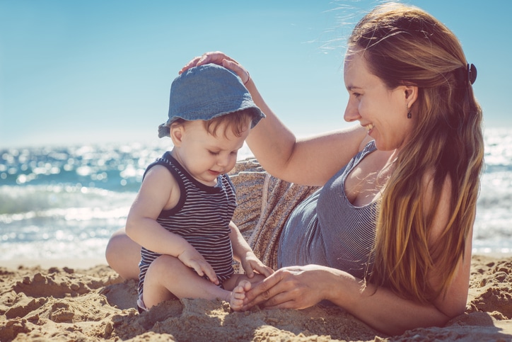 Mother and son playing on the beach