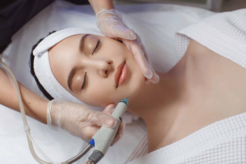 Woman receiving a DiamondGlow facial for sensitive skin rejuvenation
