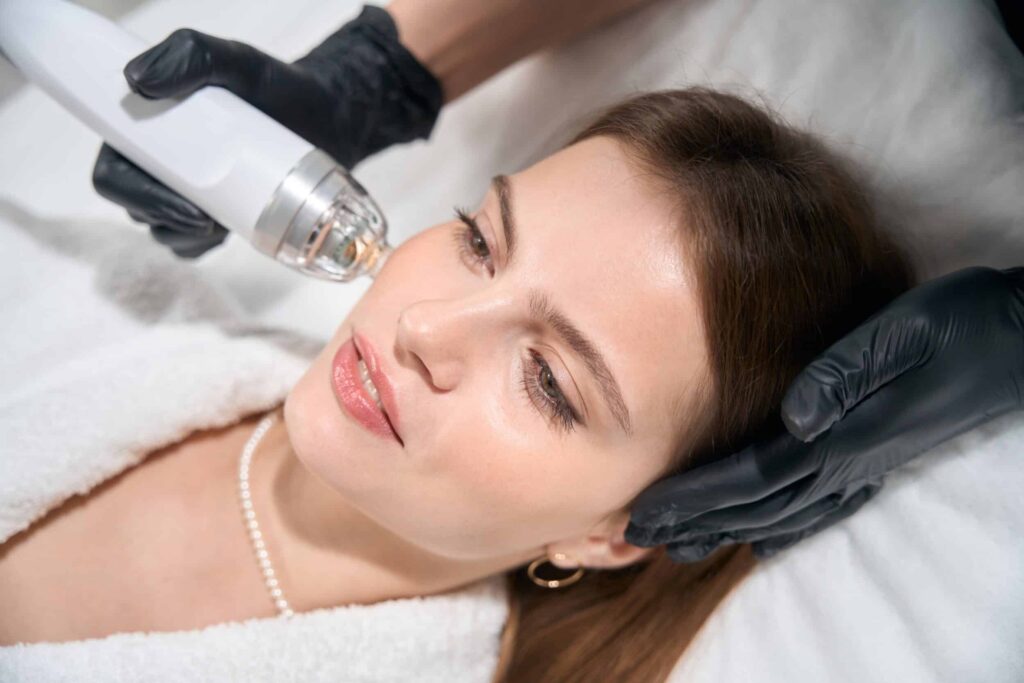 Beautiful woman having a Halo Laser treatment performed on her face for smoother, shining skin
